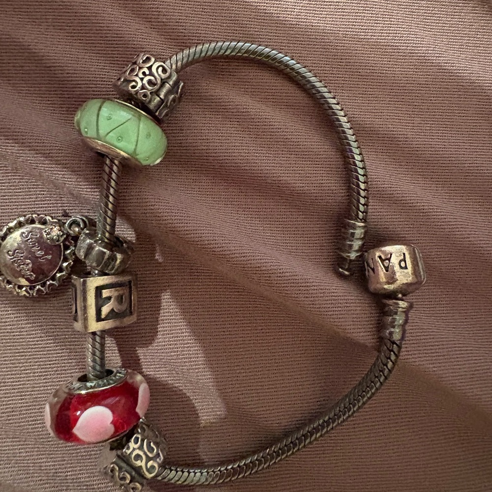 Elegant Silver Charm Bracelet with Green and Red Accents
